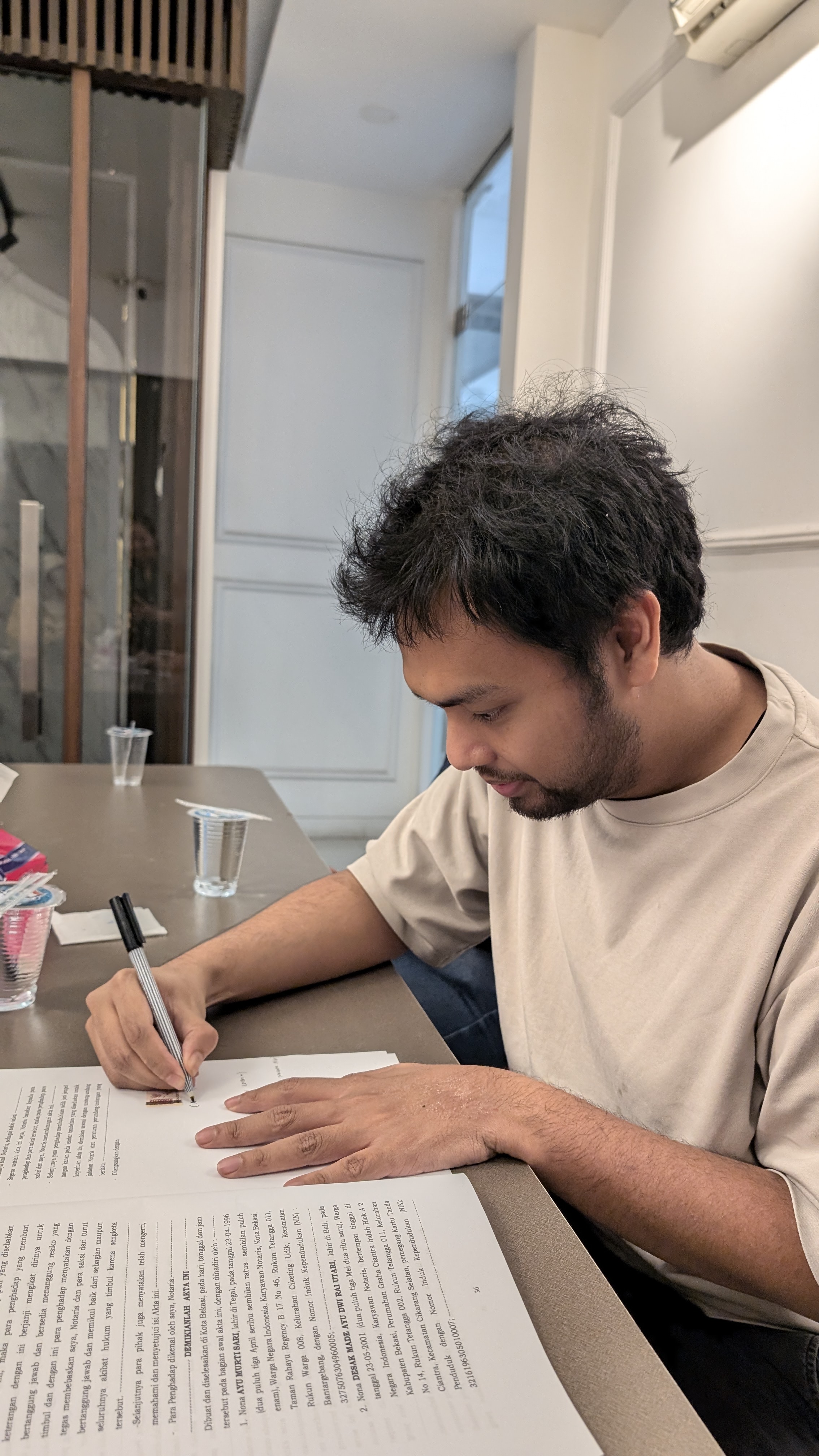 Aji signing documents