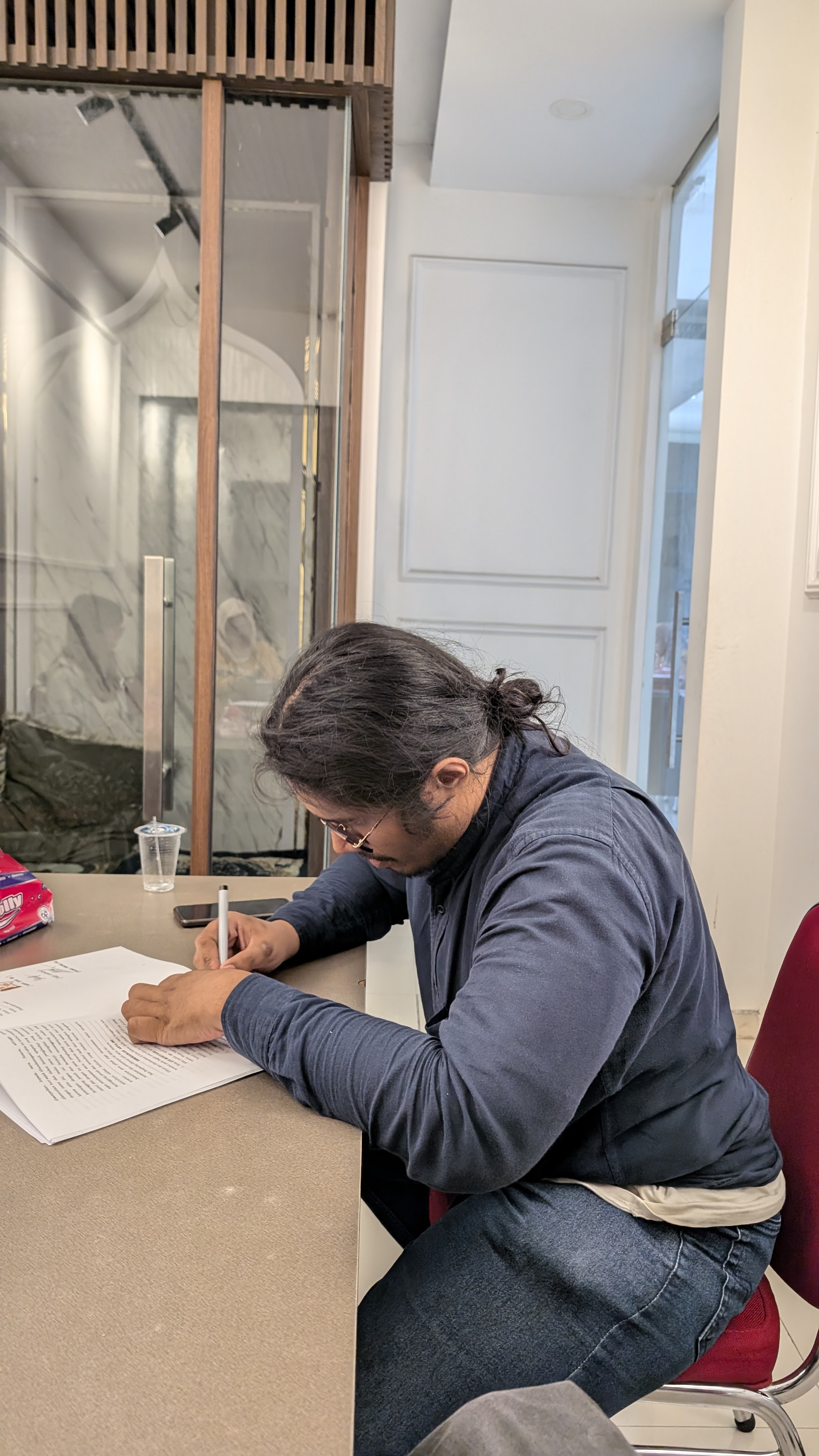 Sabil signing documents